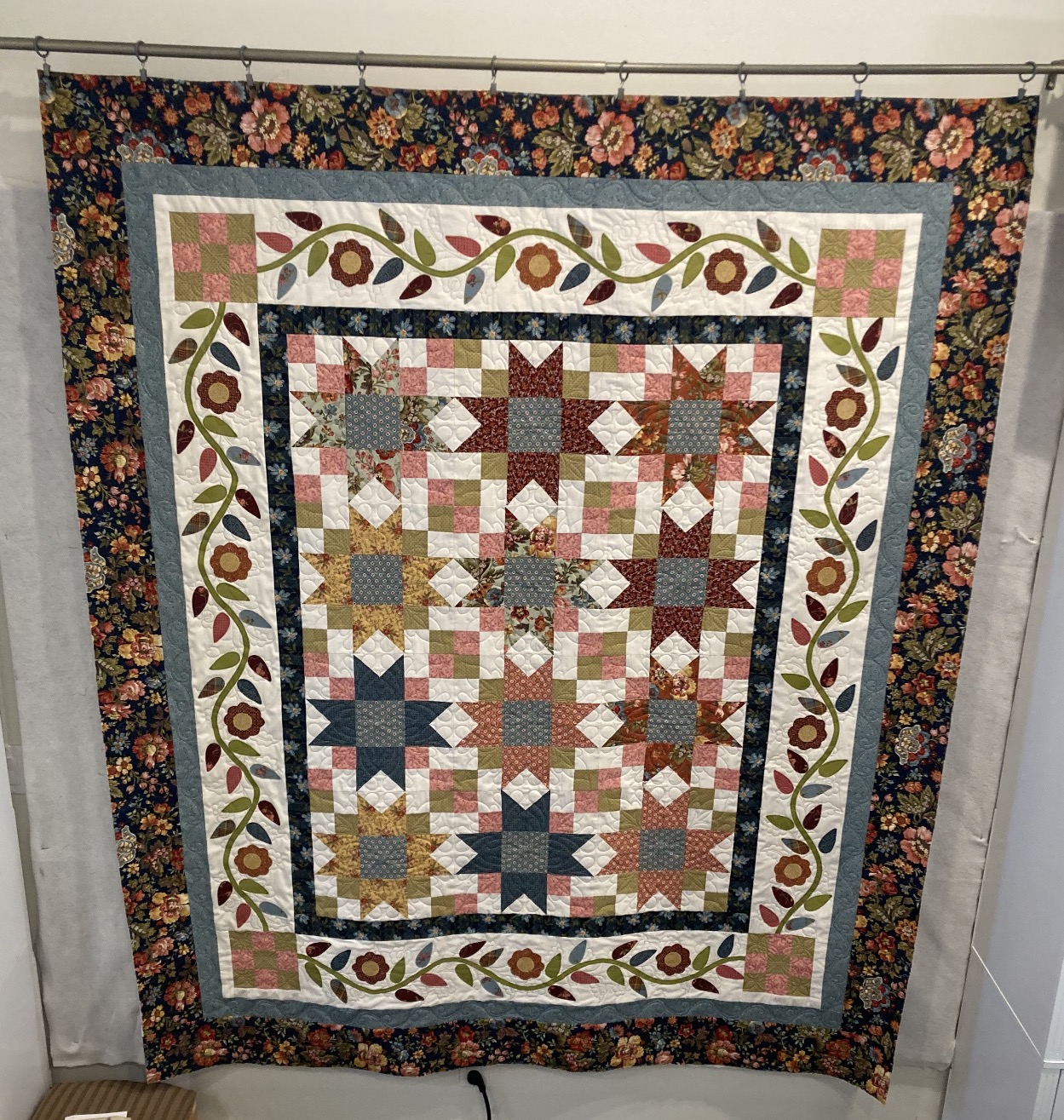 Michele’s floral and star-patterned quilt The Farmer’s Daughter displayed at the 2026 Blaine County Fair