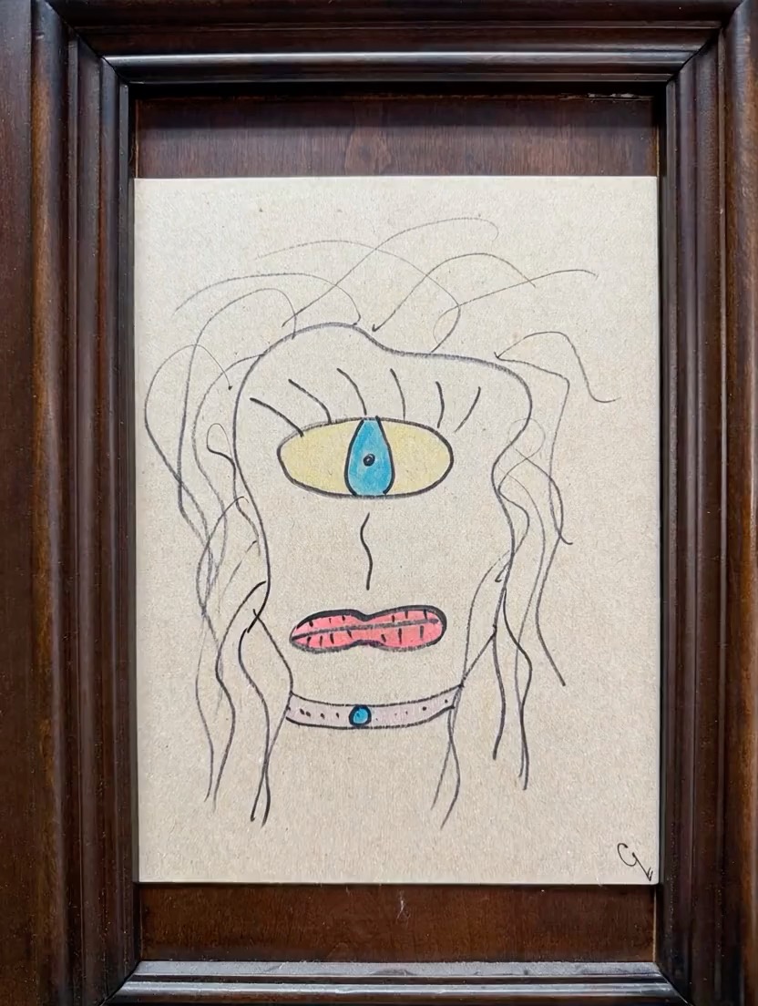 Closer view of Whit’s framed one-eyed portrait